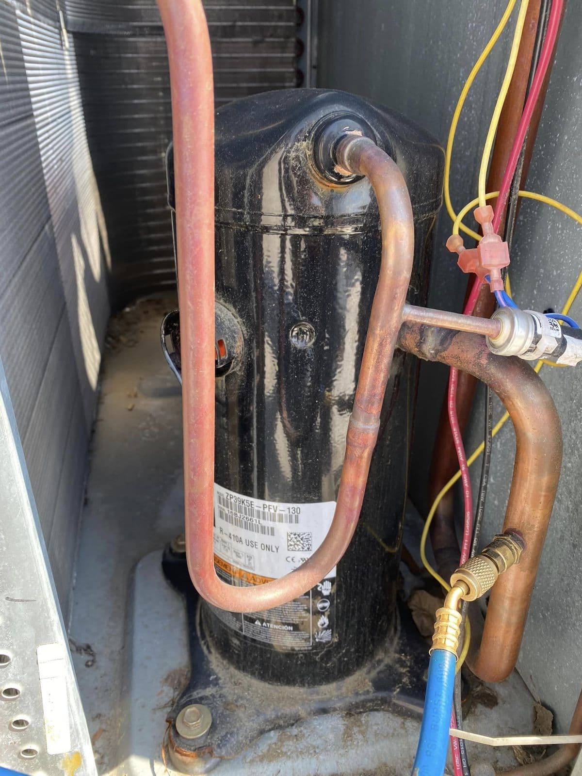 Compressor and copper lines inside an outdoor unit