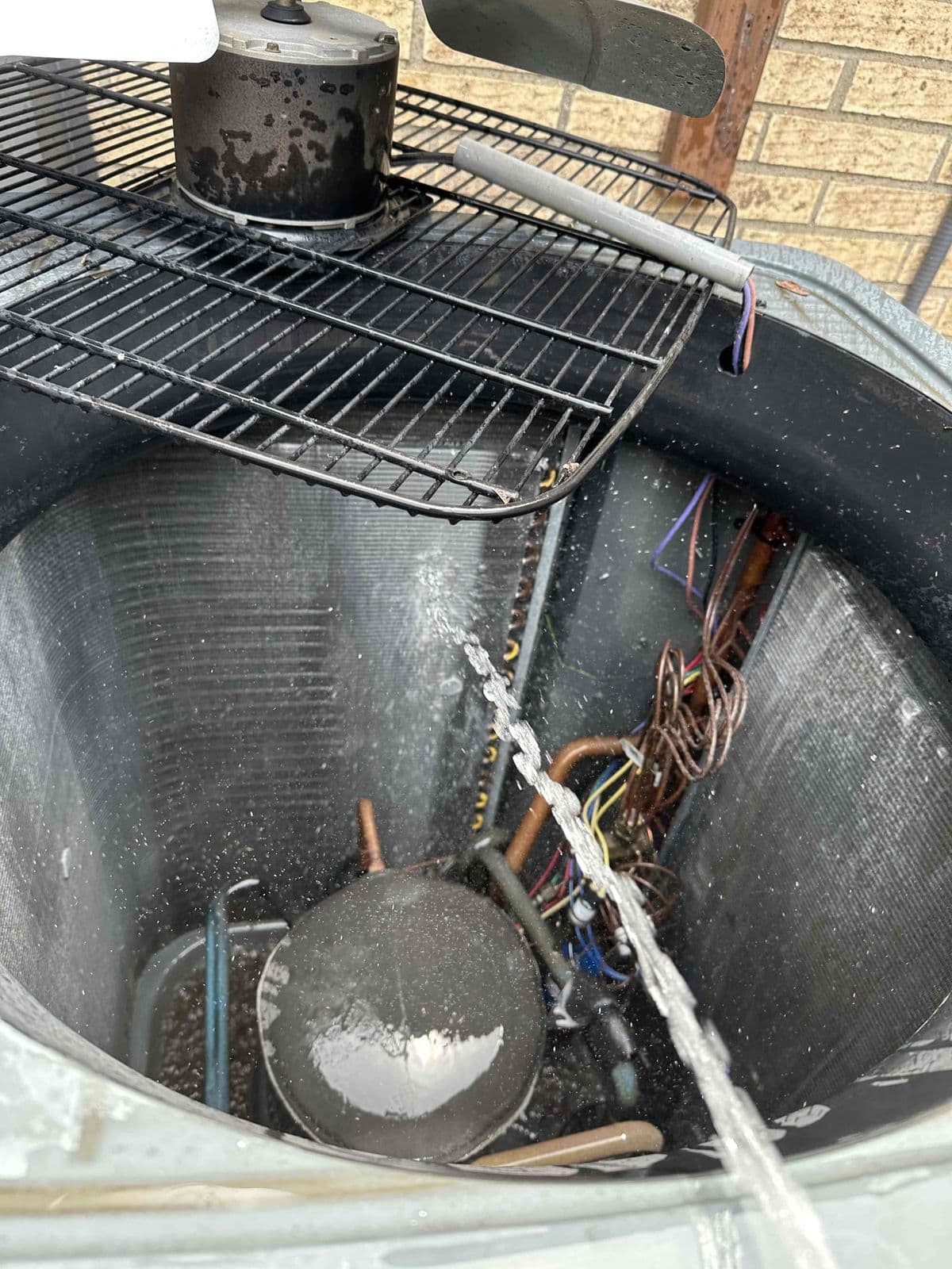Condenser coil being rinsed with water, viewed from above