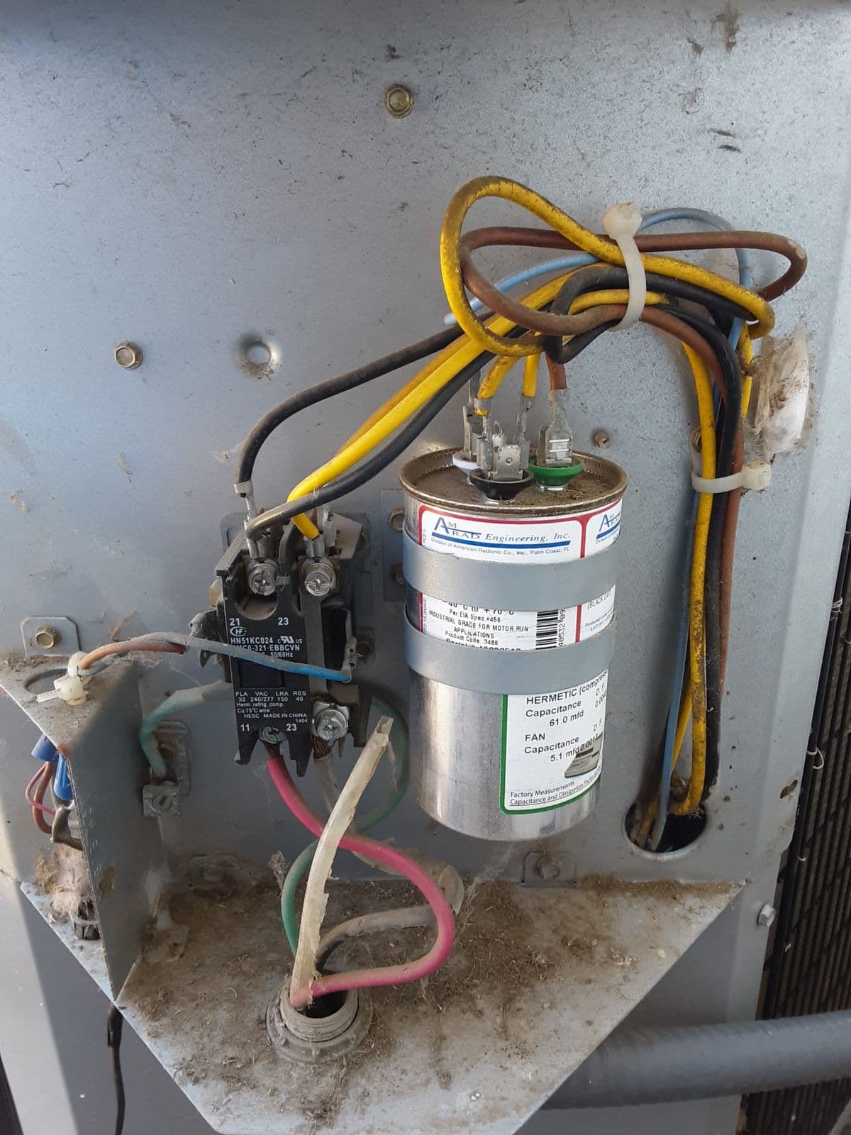 Run capacitor and wire connections inside an outdoor unit