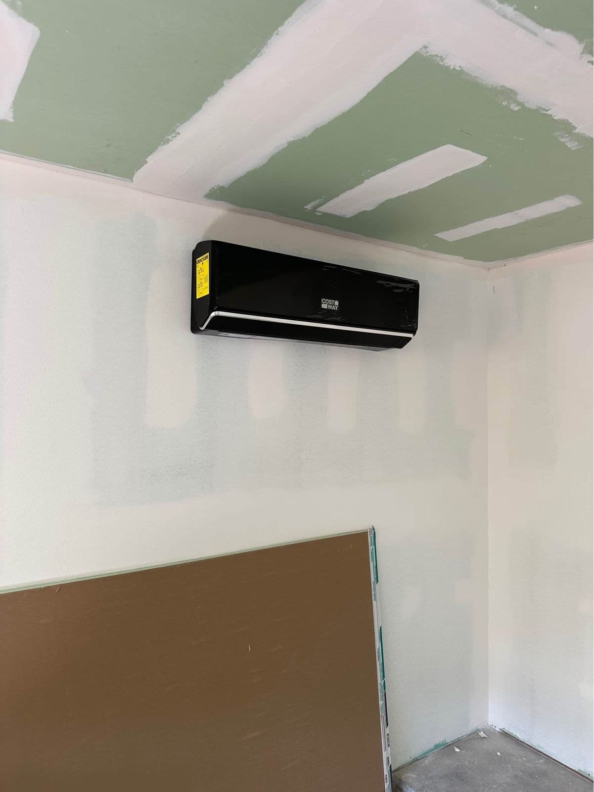 Ductless indoor unit in a room under renovation