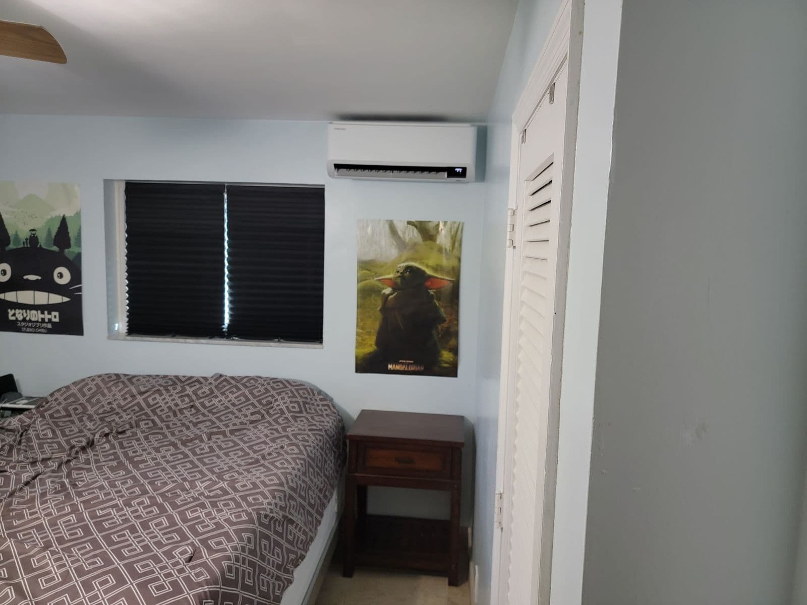Wall mounted mini split above a bed