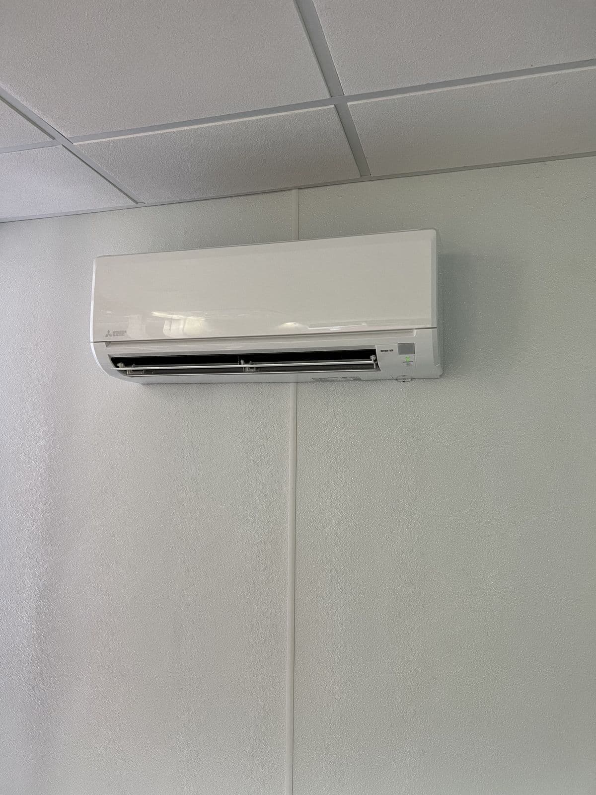 Wall mounted split system in a white room