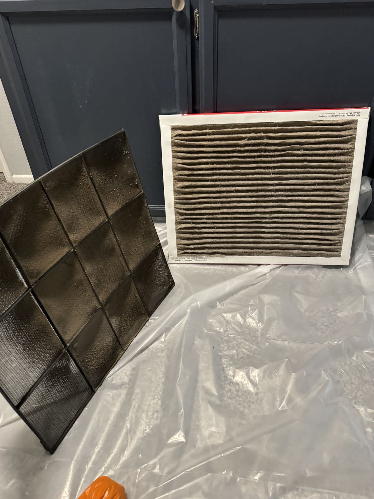 Dirty filter next to a new one