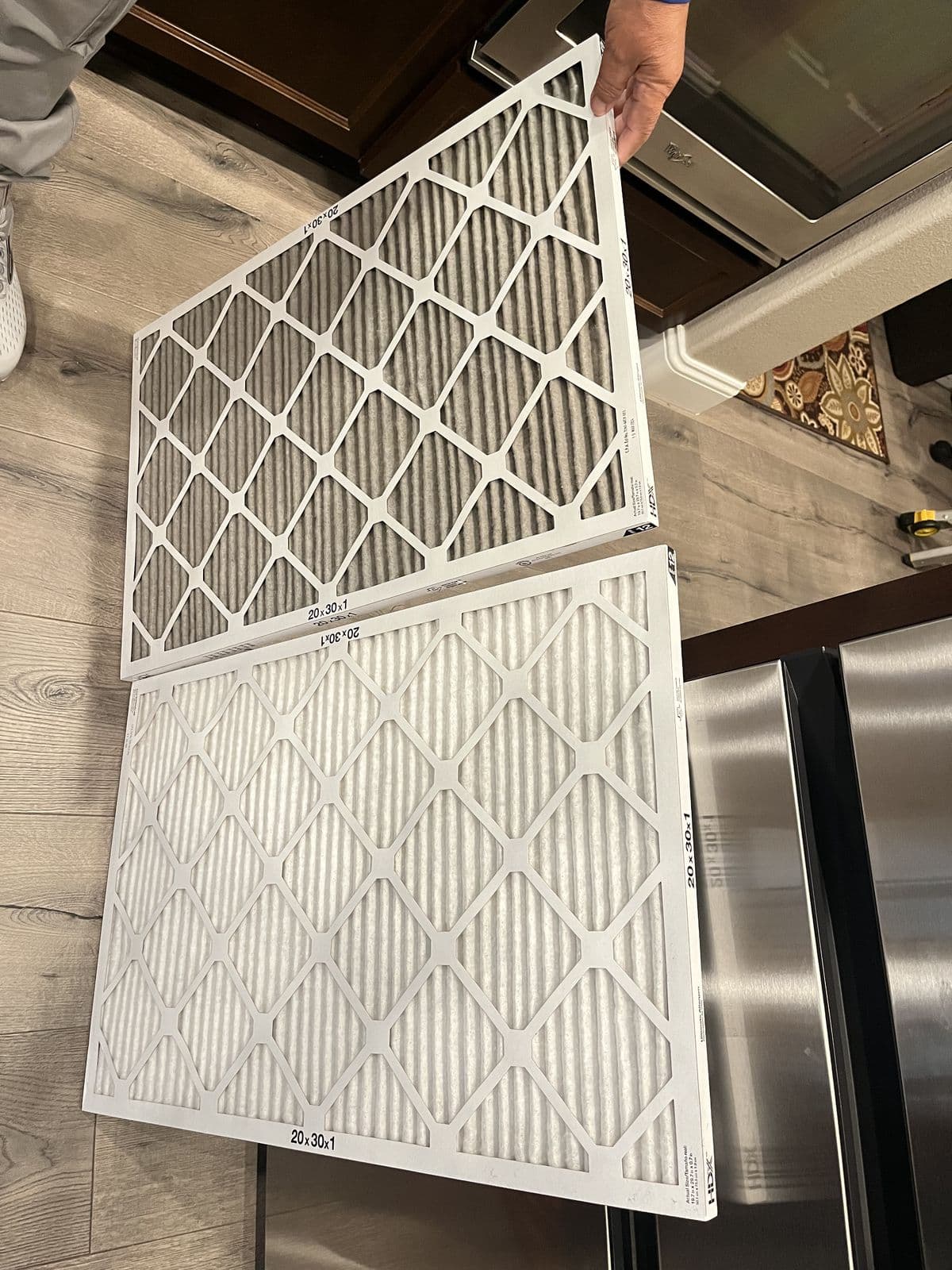 Dirty and new pleated filters side by side