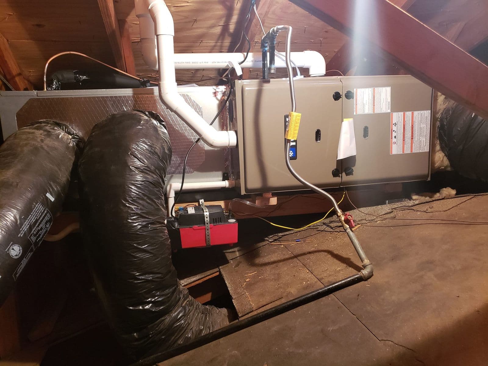 Attic furnace with a drain line and wiring