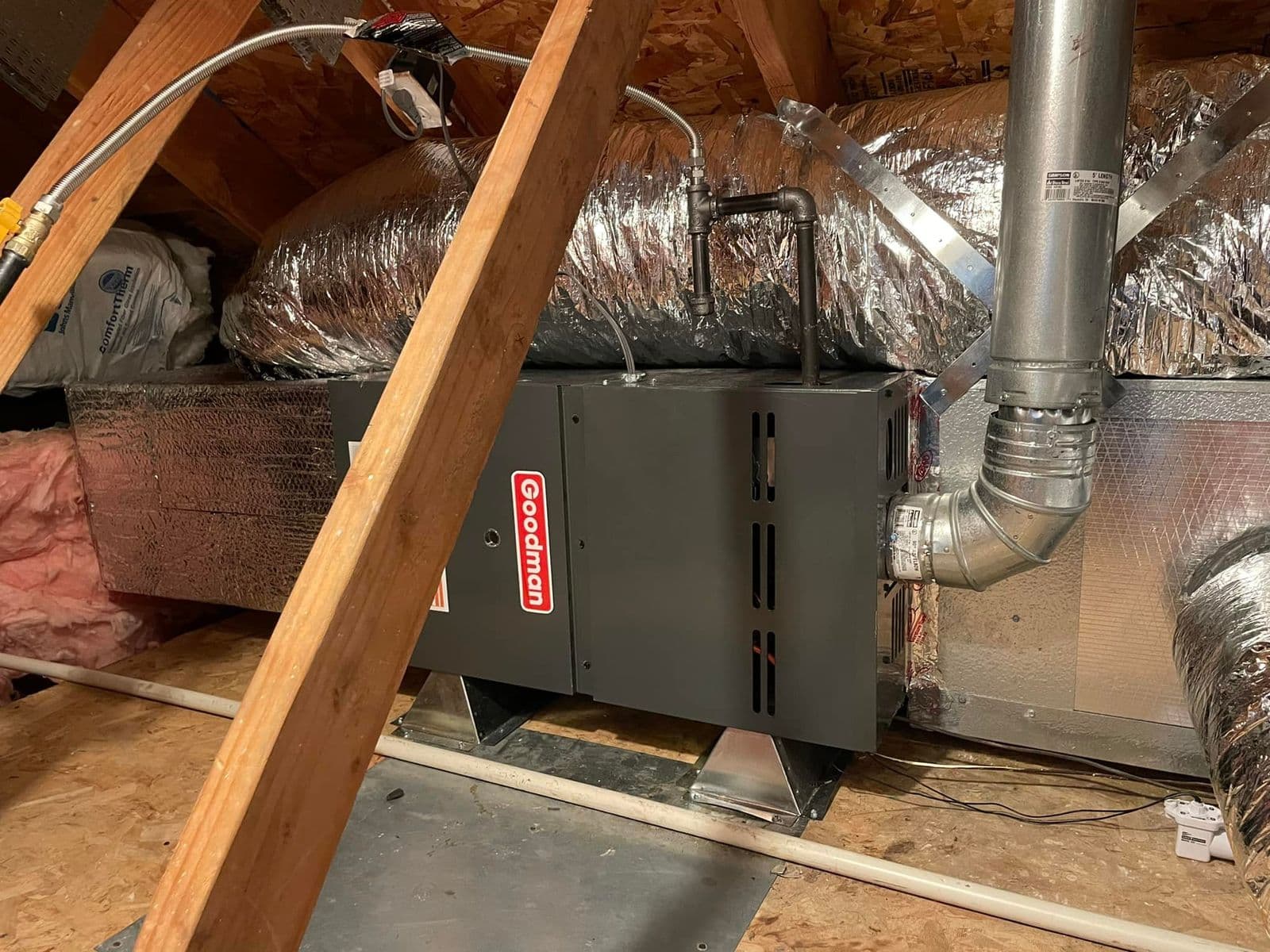 Attic furnace with ducts and a drain line