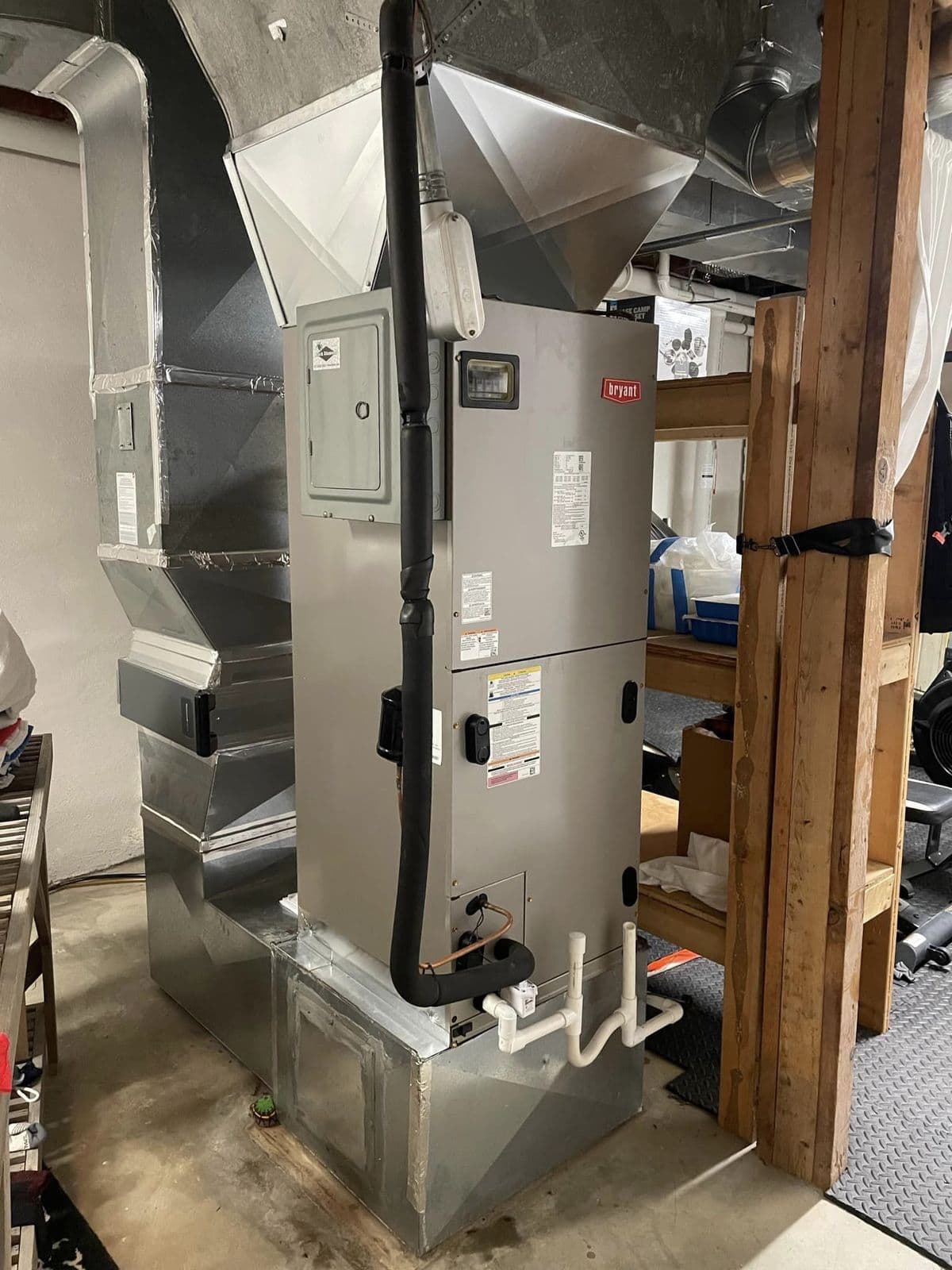 Furnace and air handler in a closet with new ductwork