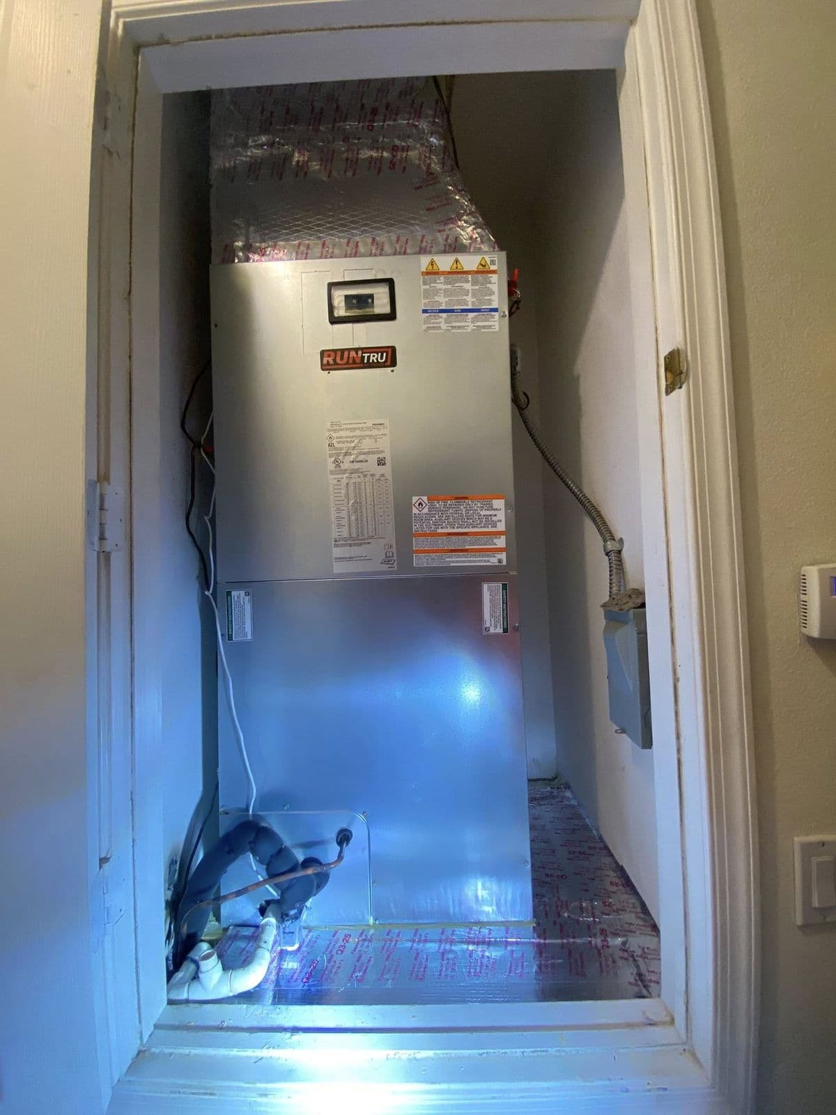 Furnace in a closet lit for inspection