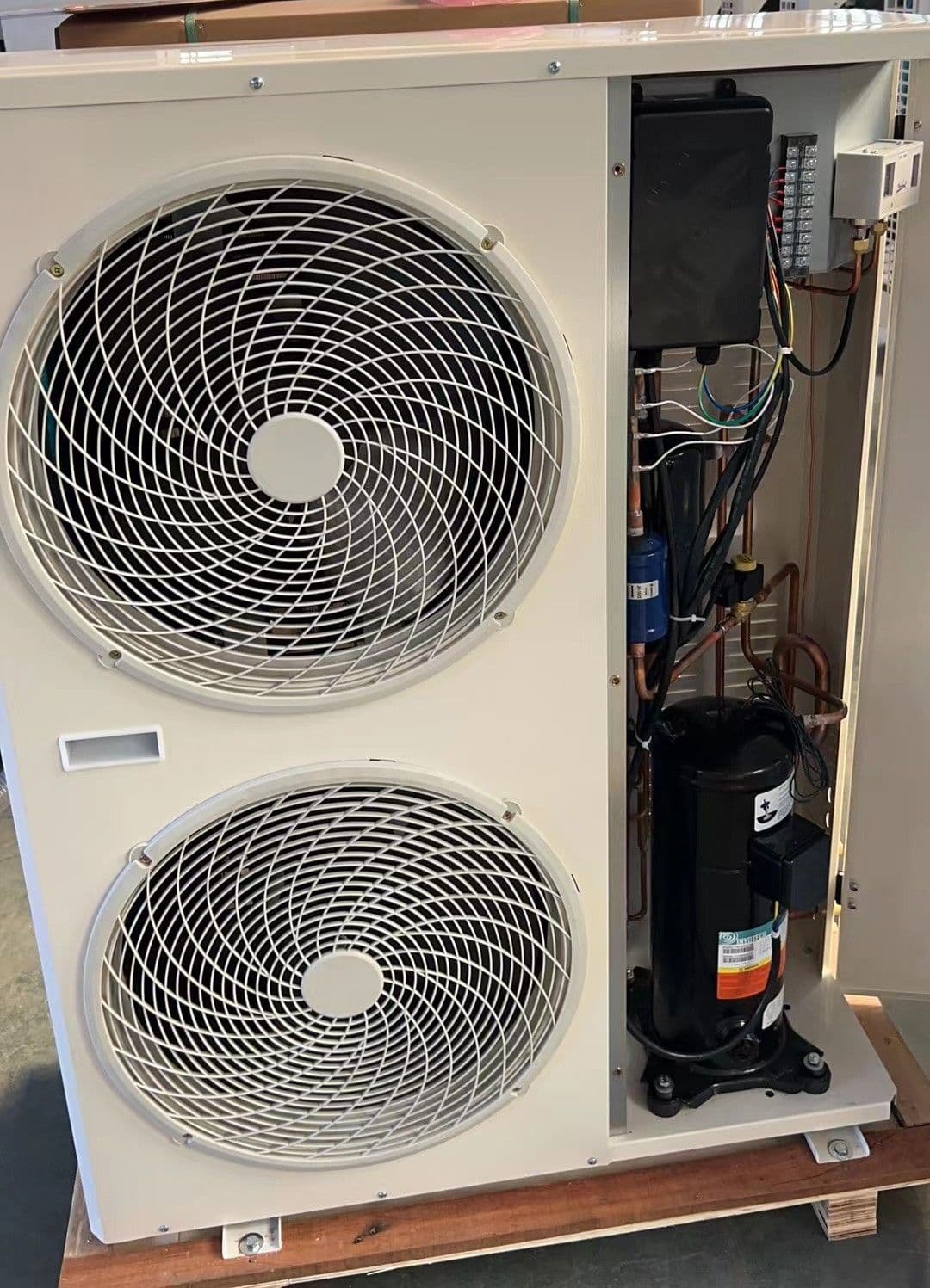 Large dual fan outdoor unit with the panel open