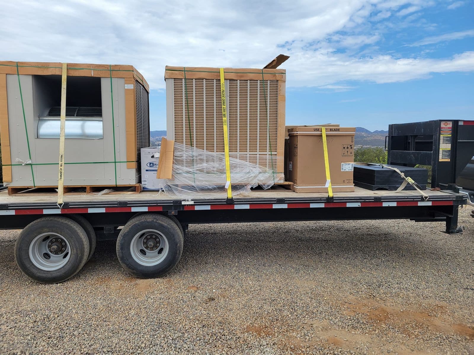 Delivery trailer loaded with new HVAC equipment