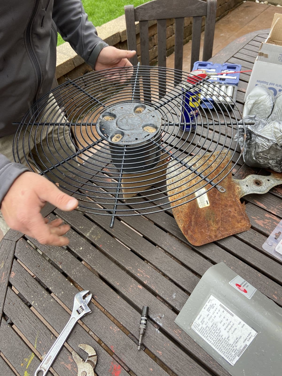 Condenser fan motor and blade removed from an outdoor unit