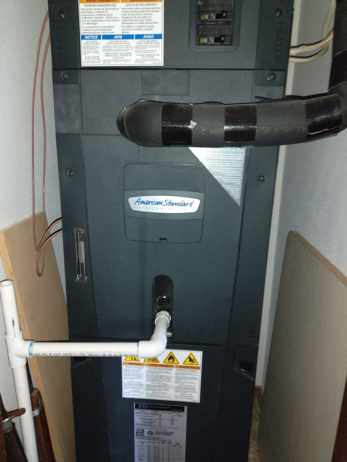 American Standard furnace in a utility space
