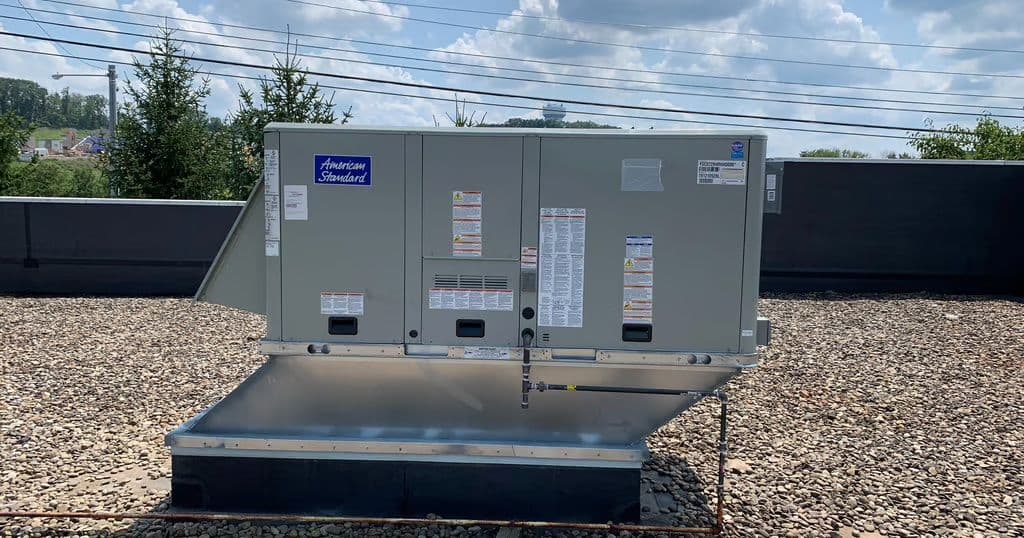 American Standard rooftop unit on a gravel roof