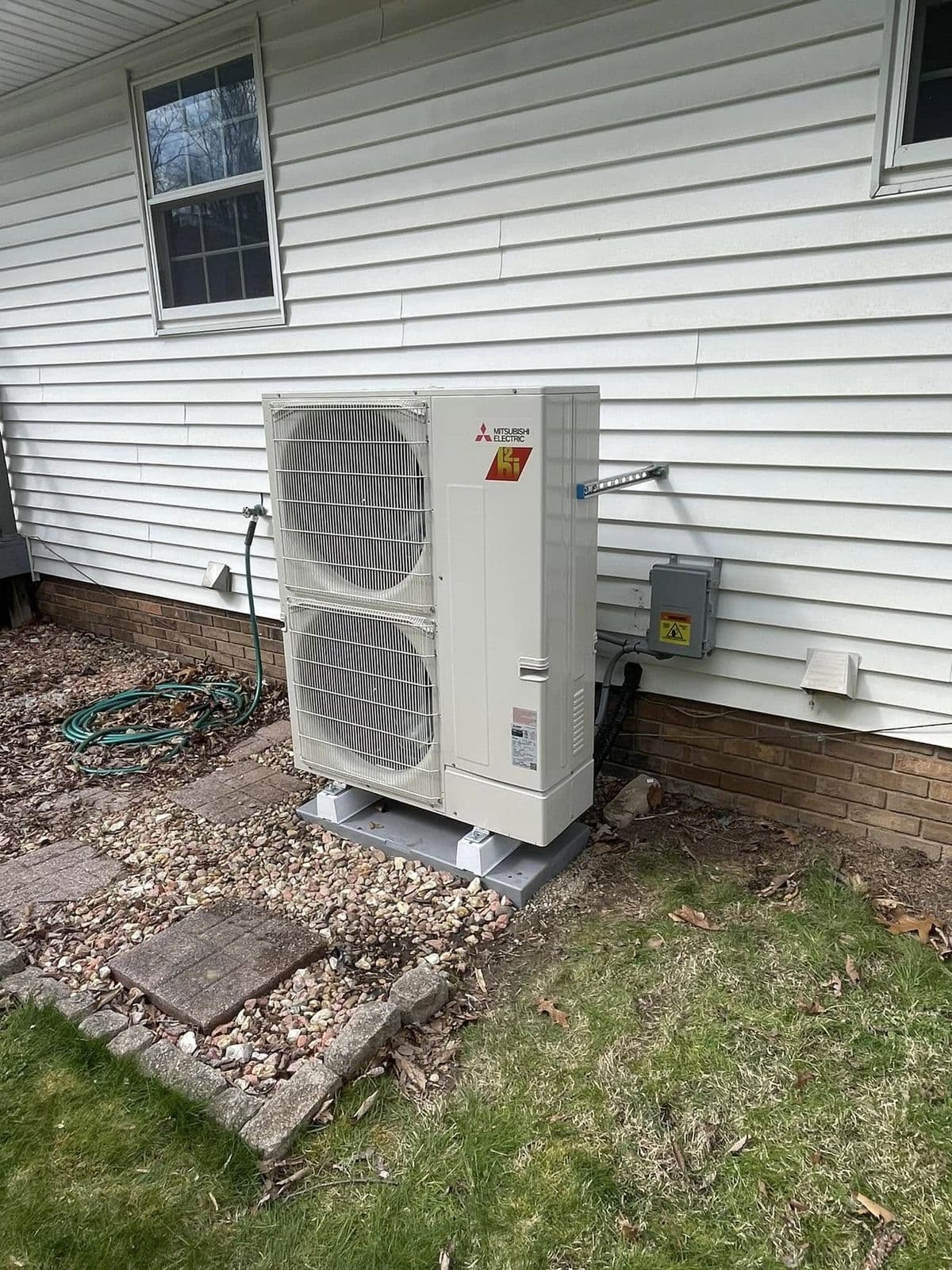 Mini split outdoor unit on siding
