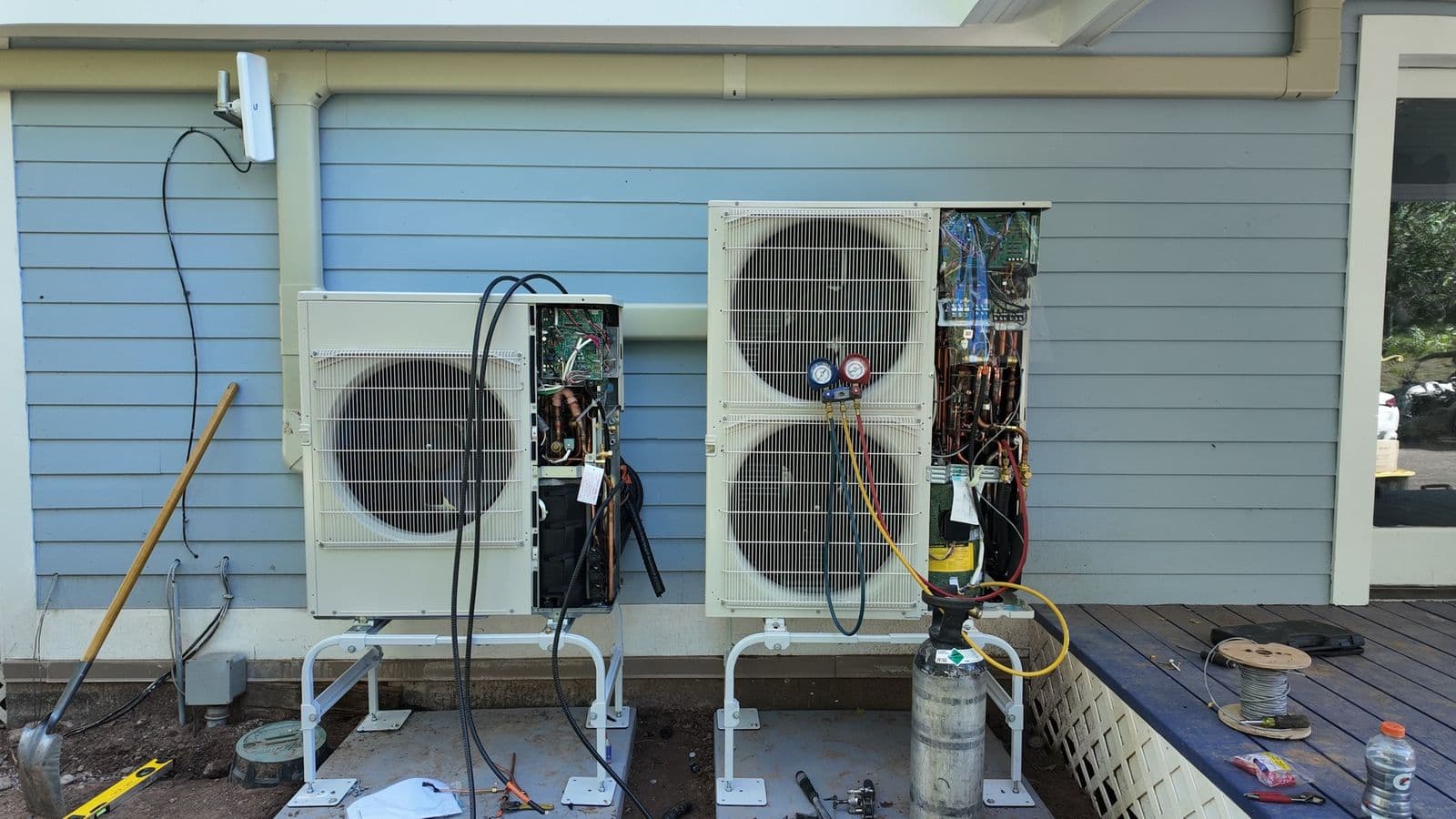 Two mini split outdoor units at a repair and installation job