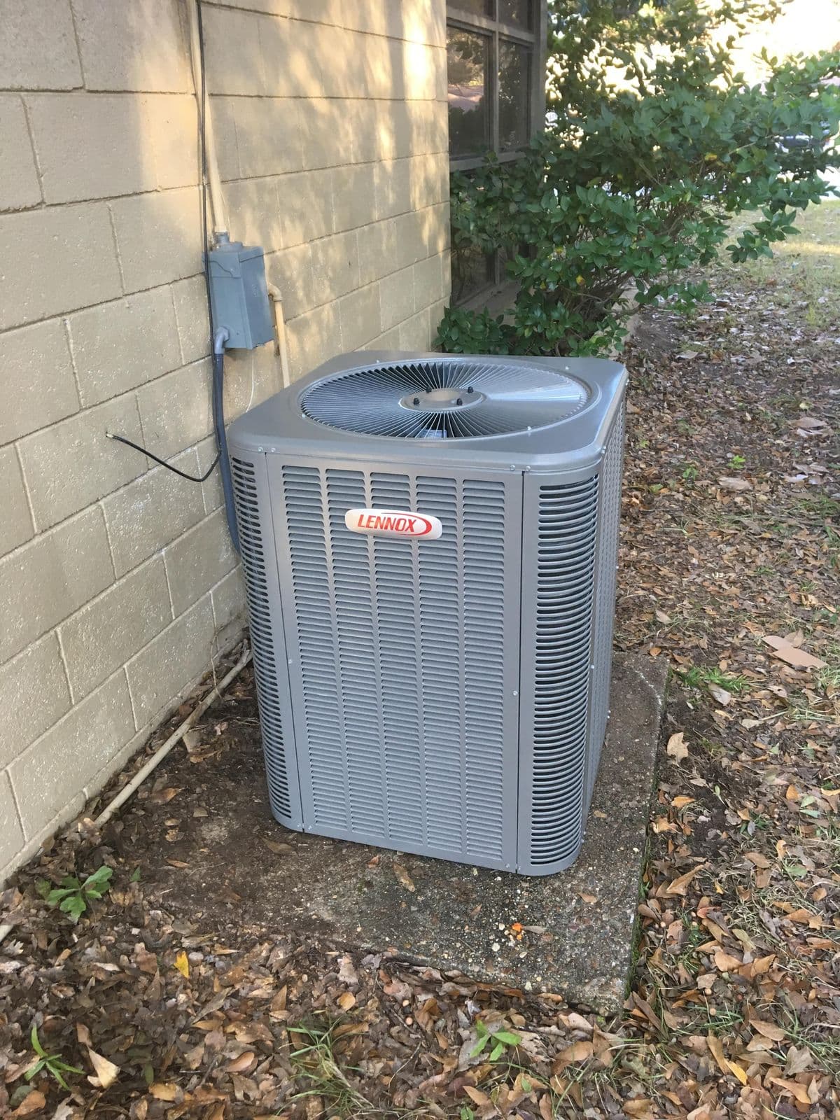 Lennox outdoor condenser beside a house