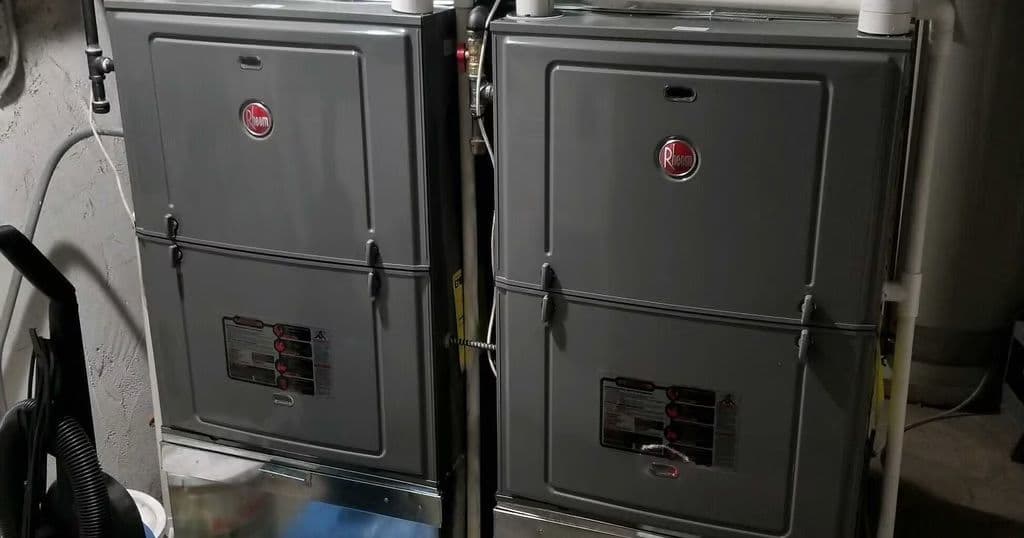 Two Rheem furnaces installed in a closet