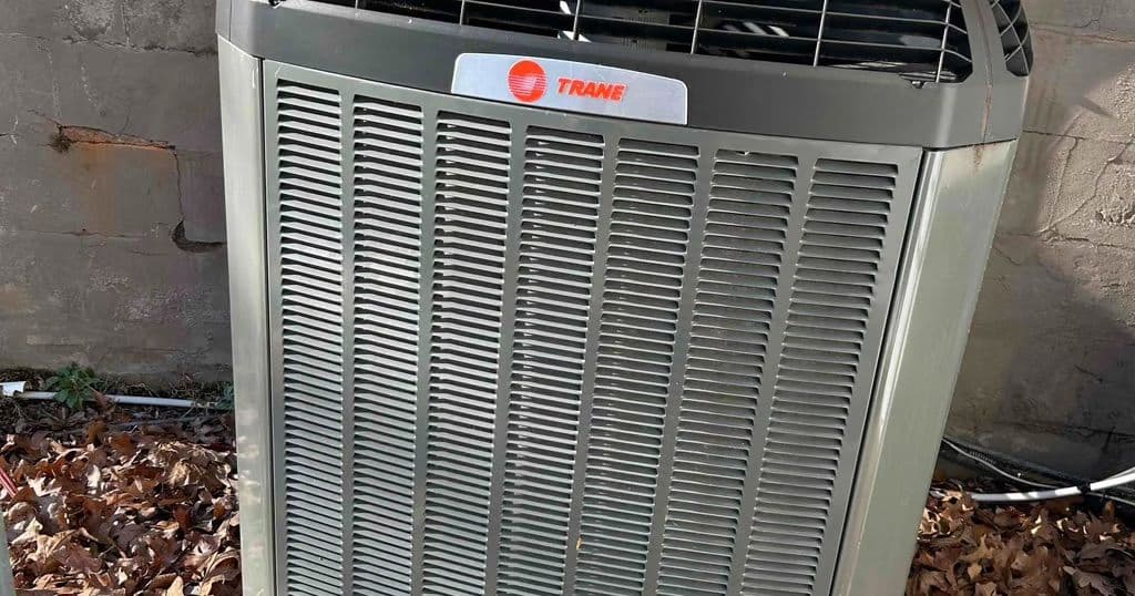 Trane condensing unit beside a house